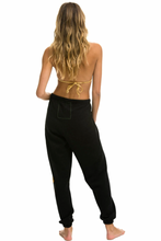 Load image into Gallery viewer, AVIATOR NATION SMILEY SUNSET WOMENS SWEATPANTS - BLACK