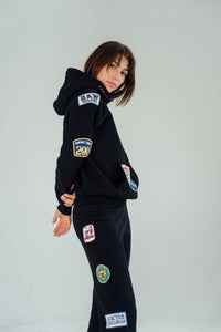 Riley Vintage Side Patched Up Hoodie in Black ships in 2 weeks